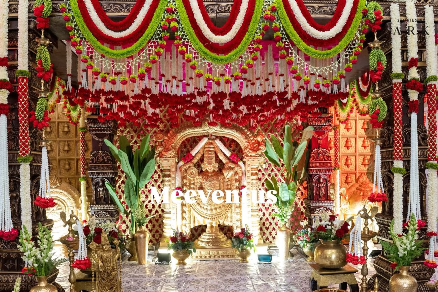 Grand temple-style muhurtham mandap with garlands
