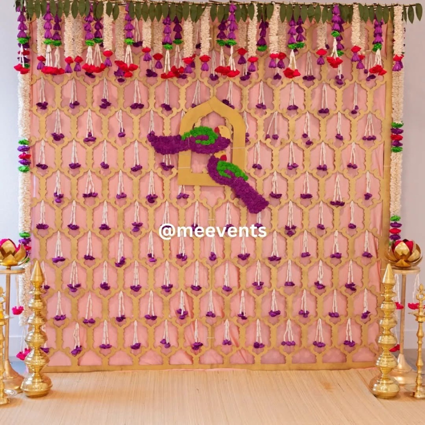 Pink lattice backdrop with floral tassels