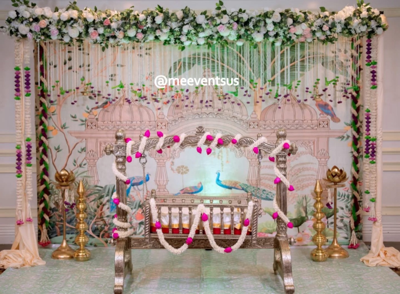 Cradle ceremony decor with pastel peacock backdrop