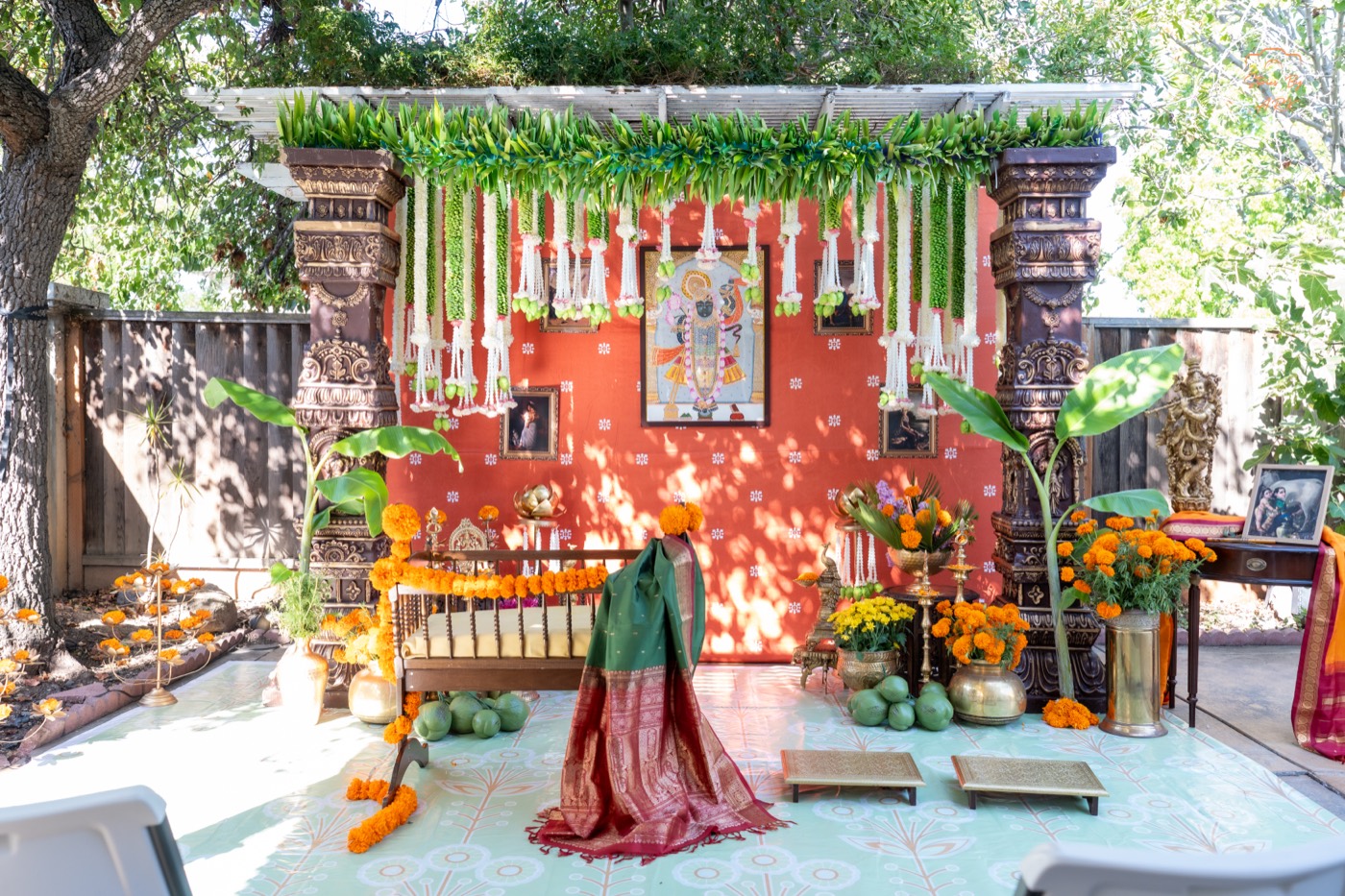 Outdoor Seemantham setup with mango-leaf canopy and Srinathji backdrop