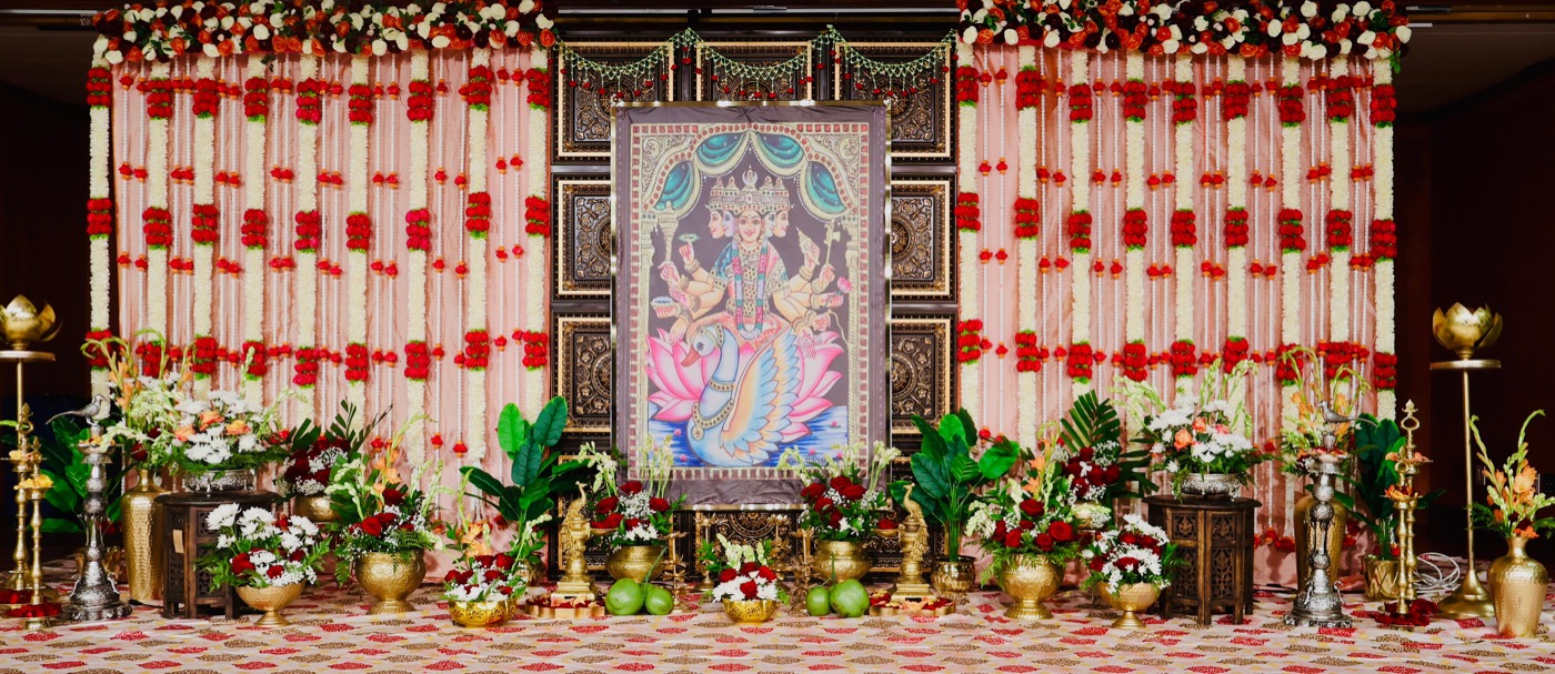 Grand Gajalakshmi pooja stage with garland curtains
