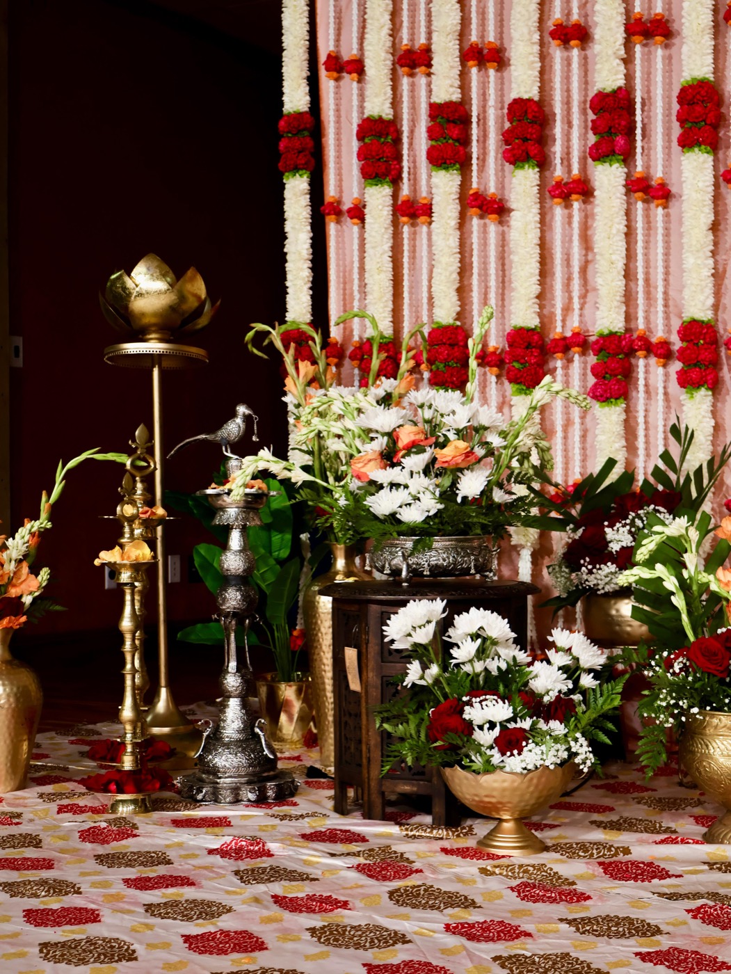 Brass and silver lamps with fresh floral arrangements
